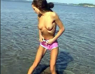 Tanned, nude teen spurting in the sea