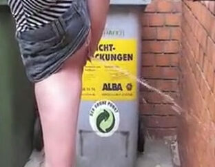Sizzling dame urinating on public place