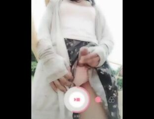 Adorable Chinese t-girl in a public playground being sissy